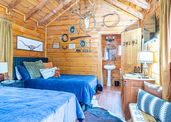 Lake George cabin rental with two queen beds and western-themed decor